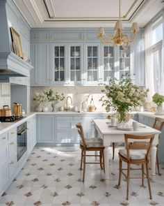 a kitchen filled with lots of white counter top space next to a dining room table