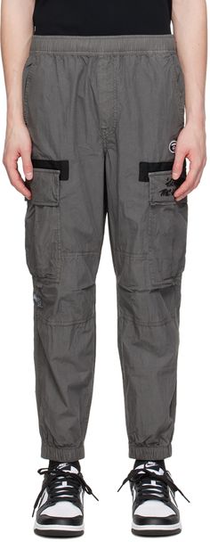 Cotton- and nylon-blend taffeta cargo pants. · Concealed drawstring at elasticized waistband · Four-pocket styling · Mock-fly · Embroidered logo patch at front · Elasticized cuffs · Cargo pocket at outseams · Text embroidered at cargo pocket and back · Logo patch at outseam and back Supplier color: Black Bathing Ape, Cargo Pocket, A Bathing Ape, Cargo Pants, Patch Logo, Apparel Accessories, Outfit Accessories, Luxury Fashion, Pants