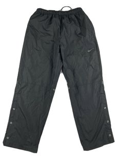 NIKE GOLF Activewear Pants Mens XL Black Snapped Ankle Elastic Waist Pockets Size - XL mens USMaterial - 100% Polyester Color - Black Waist lying flat - 16.5" Elastic Front rise - 14" Inseam - 32" Leg opening - 10" Please see photos for exact details. All measurements are approximate and were taken with the garment lying flat I accept all reasonable offers! Casual Nike Golf Bottoms, Nike Golf, Active Wear Pants, Long Pants, Parachute Pants, Mens Pants, Elastic Waist, Elastic, Active Wear