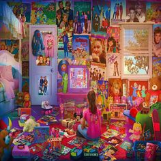 a child sitting on the floor in front of a room filled with toys and books