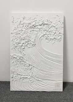 an abstract white painting on the wall