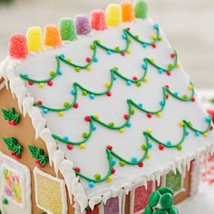 a gingerbread house decorated with icing and candy