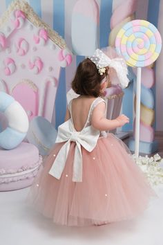 Look no further than our stunning tutu dress, perfect for birthdays, parties, weddings, and any other special occasion. Here are the features that make it the perfect choice: ➤ Stretchy Fabric and Cotton Lining for Comfort and Movement ➤ Available in Multiple Colors and Sizes ➤ Customizable Back Model and Backless Design ➤ Perfect for Any Occasion and All Seasons ➤ Handmade to Order and Packaged with Care ➤ Optional Add-Ons for a Special Touch ➤ Easy to Care For ➤ Order Now and Receive Within 3 Days Our dress is designed with your child's comfort in mind. The top is made with stretchy Lycra fabric, while the tulle is gathered at the waist with a stretchy Lycra fabric that fits snugly to the body. Underneath the tulle, there's a cotton lining that keeps your child comfortable while wearing Elegant Tutu Dress With Tulle Skirt For Birthday, Elegant Princess Dress With Tulle Skirt For Birthday, Elegant Birthday Princess Dress With Tulle Skirt, Elegant First Birthday Tulle Tutu Dress, Elegant Tulle Princess Dress For First Birthday, Princess Style Tulle Dress For First Birthday, Tutu Dresses, Lycra Fabric, Backless Design