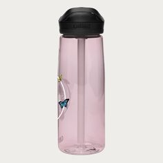 a pink water bottle with a blue butterfly on the side and a black lid is shown