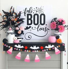 a decorated mantle with halloween decorations on it