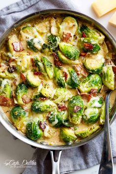 brussel sprouts with bacon and cheese in a pan on a table