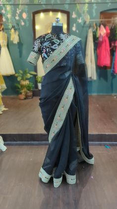 Beautiful classy black organza saree, matching heavy embroidery blouse. Blouse will be custom tailored to fit your Saree length 5.5 meters Blouse custom stitched. Measurements sheet will be provided. Petticoat included  Please do send a message if you have any questions Black Semi-stitched Saree With Resham Embroidery, Semi-stitched Black Saree With Resham Embroidery, Ceremonial Black Semi-stitched Saree, Black Semi-stitched Organza Saree, Green Velvet Blouse, Black Organza Saree, Black Silk Embroidered Saree Fabric, Multicolor Sequins, Sequin Blouse