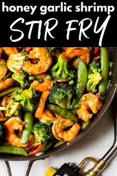 stir fry with broccoli, shrimp and green beans in a skillet text reads honey garlic shrimp stir fry