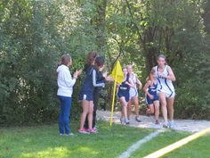 some girls are running in a race and one girl is talking to the other woman