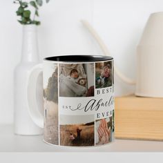 a coffee mug that has pictures of people and animals on it next to a book