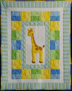 a giraffe quilted onto the side of a wall