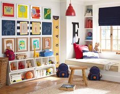 a child's room with lots of pictures on the wall