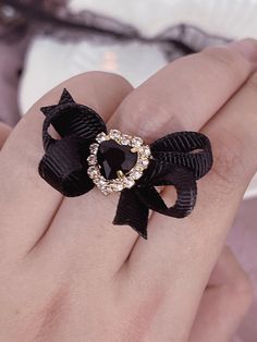 The price is for a ring only, others are not included. Adjustable Rhinestone Rings For Gifts, Black Jewelry For Valentine's Day Party, Gift Rings With Rhinestones, Elegant Heart Shaped Rings For Parties, Elegant Heart-shaped Rings For Party, Black Bow Jewelry Gift, Black Bow Jewelry For Gifts, Black Bow Jewelry For Gift, Elegant Black Jewelry With Bow Detail