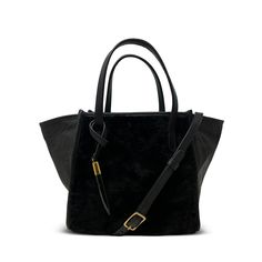 Our Mini Tote in black shearling and soft black leather mix is the epitome of subtle luxury. Small, discreet, silent, it's only on second looks that this bag reveals its sublime quality, richness and stealthy wealth appeal of cuddly lambskin and butter soft leather. Dressed up, or dressed down, handheld, or worn crossbody, but always with our signature toggle, this bag has so much attitude it's going to be hard for others to keep their hands off you. Everyone's going to want to touch this bag. W Luxury Leather Shoulder Bag With Faux Fur Lining, Elegant Evening Bags With Faux Fur Lining, Elegant Rectangular Shoulder Bag With Faux Fur Lining, Luxury Bags With Faux Fur Lining For Everyday Use, Black Suede Luxury Shoulder Bag, Luxury Black Suede Shoulder Bag, Elegant Evening Shoulder Bag With Faux Fur Lining, Black Rectangular Bag With Faux Fur Lining, Leather Bag With Faux Fur Lining