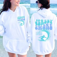 New Jersey Sweatshirt, Oceancore, Repect the locals hoodie, Ocean beach sweatshirt, Siesta Beach hoodie, Surfer sweatshirt Beach Sweatshirts: https://etsy.me/3pdRnVI Beach Hoodies (front/back designs): https://etsy.me/37eabgO Beach Hoodies (back only designs): https://etsy.me/3BcsHPQ OUR SIZING IS ADULT UNISEX. This means it will be larger than normal women's sizing.  Please see photos for size charts 🌻 Please read the full description:   This hoodie/sweatshirt sizing is NOT oversized.  You nee Summer Sporty Crew Neck Hoodie, Beach Season Streetwear Sweatshirt Crew Neck, White Hooded Top With Screen Print, Summer White Hoodie For Streetwear, Summer Casual Hoodie With Letter Print, White Hoodie For Summer Streetwear, Casual Summer Hoodie With Letter Print, Casual Surfing Hoodie With Graphic Print, Casual Surfing Hoodie Sweatshirt