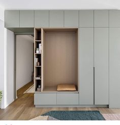 an open cabinet in the middle of a room