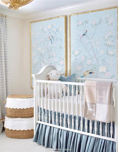 a baby's room with blue and white decor