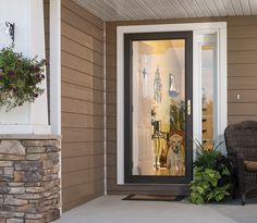 the front door is open and there are two chairs on the porch next to it