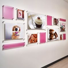 the wall is decorated with pink and white photos, including cupcakes and teddy bears