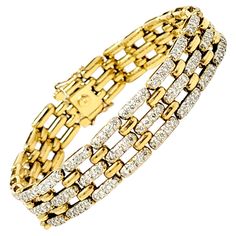 Gorgeous glittering diamond bracelet looks elegant and sophisticated on the wrist. This 1/2" wide solid 18 karat yellow gold bracelet sparkles and shines with 260 round diamonds prong set into attractive, elongated links. There are approximately 5.50 carats total in this incredible piece. The diamonds are H in color, VS in clarity and really pop against the yellow gold. It has a locking push clasp and two additional safety clasps. This bracelet is an estate piece that has been professionally cle Yellow Gold Bracelet, Link Bracelets, Prong Setting, Types Of Metal, Panther, Diamond Bracelet, Round Diamonds, Jewelry Box, Gold Bracelet