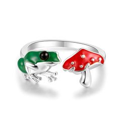 PRICES MAY VARY. Frog and Mushroom is most beautiful encounter, the frog and mushroom are symbols of good luck and energy . A cute frog and a red mushroom , showing a scene full of vitality. Frog mushroom rings, a cute finger jewelry gift for women girls, bring lucky for your loved one. Frog mushroom rings is made of high quality environmental protection brass statement high polish tarnish resistant silver plated to protect the frog mushroom rings from fading & oxidized,free of lead and nickel, Mushroom Rings, Frog Rings, Aesthetics Jewelry, Frog Mushroom, Mushroom Ring, Finger Jewelry, Red Mushroom, Open Rings, Green Frog