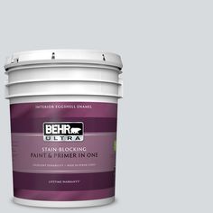 a white paint bucket with the label behr ultra stain and primer in one