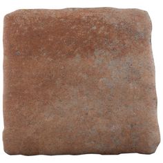 a square stone with some dirt on the bottom and one in the middle, against a white background