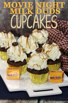 chocolate cupcakes with white frosting and caramel drizzle on top