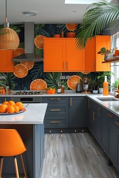 an orange themed kitchen with grey cabinets and white counter tops is featured in this image