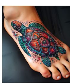 a colorful turtle tattoo on the foot