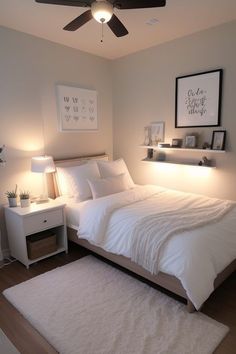 a bedroom with a bed, nightstand and ceiling fan