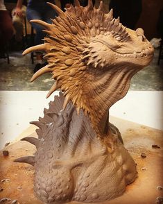 a close up of a clay sculpture of a dragon