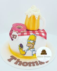 the simpsons cake is decorated with donuts and doughnuts