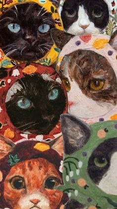 four cats with hats and scarves on their heads