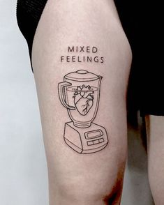 a woman's leg with a tattoo on it that says mixed feelings and a blender