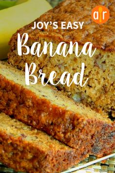 two slices of banana bread sitting on top of a cooling rack next to some bananas