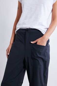 These pants combine airy comfort with a modern silhouette, offering a versatile staple for all-year-round. With their tailored fit and breathable fabric, these pants effortlessly blend sophistication with laid-back charm, making them the perfect go-to piece. Tailored fit and tapered leg Elasticized waist with hook-and-bar closure Relaxed leg Belt loops 2 side pockets Vertical seams Leg Belt, Charm Making, Slim Pants, Black Pants, Breathable Fabric, Latest Fashion, Fashion Forward, Bar, Pants