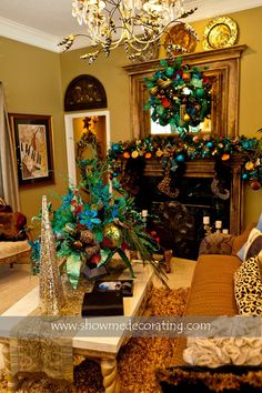 a living room filled with furniture and a christmas tree on top of a fireplace mantel