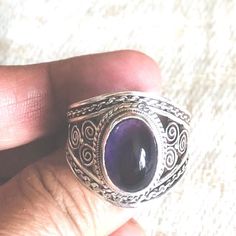 This beautiful dark amethyst ring is made in Nepal.  Made by wonderful artist  with a great quality amethyst and 9.25 silver. it is beautiful and has wonderful energy. size of the ring U.S 12.5 Silver Amethyst Bohemian Ring, Unique Purple Amethyst Ring, Bohemian Purple Rings Stamped 925, Unique Oval Amethyst Ring, Handmade Purple Amethyst Ring For Anniversary, Handmade Bohemian Amethyst Ring, Unique Purple Amethyst Gemstone Ring, Unique Amethyst Ring Stamped 925, Unique 925 Stamped Amethyst Ring