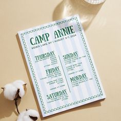 a camp anne program sitting on top of a table next to cotton floss