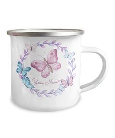 a white enamel mug with butterflies on it and the words'your name'in silver rim