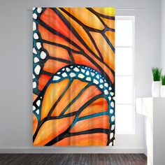 an orange and blue butterfly wing art print