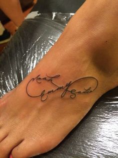 a foot with a tattoo that says love on it