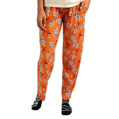 Elevate your relaxation game with this officially licensed Naruto Ichiraku Ramen Adult Juniors Sleepwear Set. This set includes a comfortable beige short sleeve tee shirt crafted from a blend of 60% cotton and 40% polyester for a soft and breathable feel. The tee shirt features a charming chibi-style Naruto Uzumaki and the iconic Ichiraku Ramen logo front and center, adding a touch of anime-inspired flair to your loungewear. Accompanying the tee shirt are vibrant orange sleep pants adorned with Orange Relaxed Fit Casual Sleepwear, Casual Cotton Bottoms For Sleepover, Casual Cotton Bottoms For Comfort, Tee Shirt Crafts, Naruto Merchandise, Repeat Prints, Beige Shorts, Sleep Pants, Pants Large