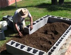 a man is digging in the ground with his hands