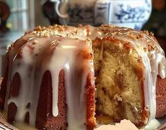 a bundt cake with white icing on a plate