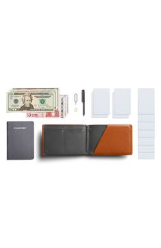 A spacious, well-organized interior means easy convenience for this travel-ready wallet that comes equipped with a micro-pen. Features like RFID shielding and a hidden cash compartment help protect you and your personal information on the road. Interior pen loop; passport compartment; slip pockets; four card slots Leather Imported Functional Leather Trifold Wallet For Travel, Leather Trifold Wallet With Hidden Phone Sleeve For Travel, Functional Bifold Card Holder For Travel, Classic Wallet With Hidden Phone Sleeve For Travel, Bifold Wallet With Hidden Phone Sleeve For Travel, Classic Wallets With Hidden Phone Sleeve For Travel, Travel Bifold Wallet With Hidden Phone Sleeve, Functional Trifold Wallet For Travel, Modern Brown Card Holder For Travel