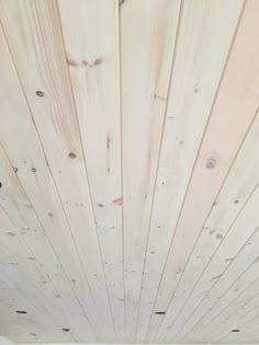 the ceiling is painted white and has wood planks