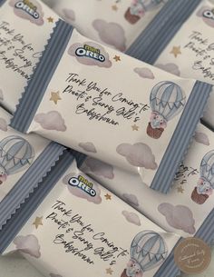 some candy bars with writing on them sitting next to each other in the shape of hot air balloons