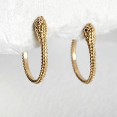 Gold plated high quality serpent hoop  earrings. Elegant addition. Handmade. Arrives in logo drawstring protective pouch Handmade Gold Snake-shaped Earrings, Handmade Gold Snake Earrings, Handmade Elegant Snake Earrings, Elegant Handmade Snake Earrings, Snake-shaped Single Earring Jewelry Gift, Snake-shaped Yellow Gold Earrings For Gift, Gold Snake-shaped Earrings For Gift, Snake-shaped Single Earring As Gift, Snake-shaped Earrings For Gifts